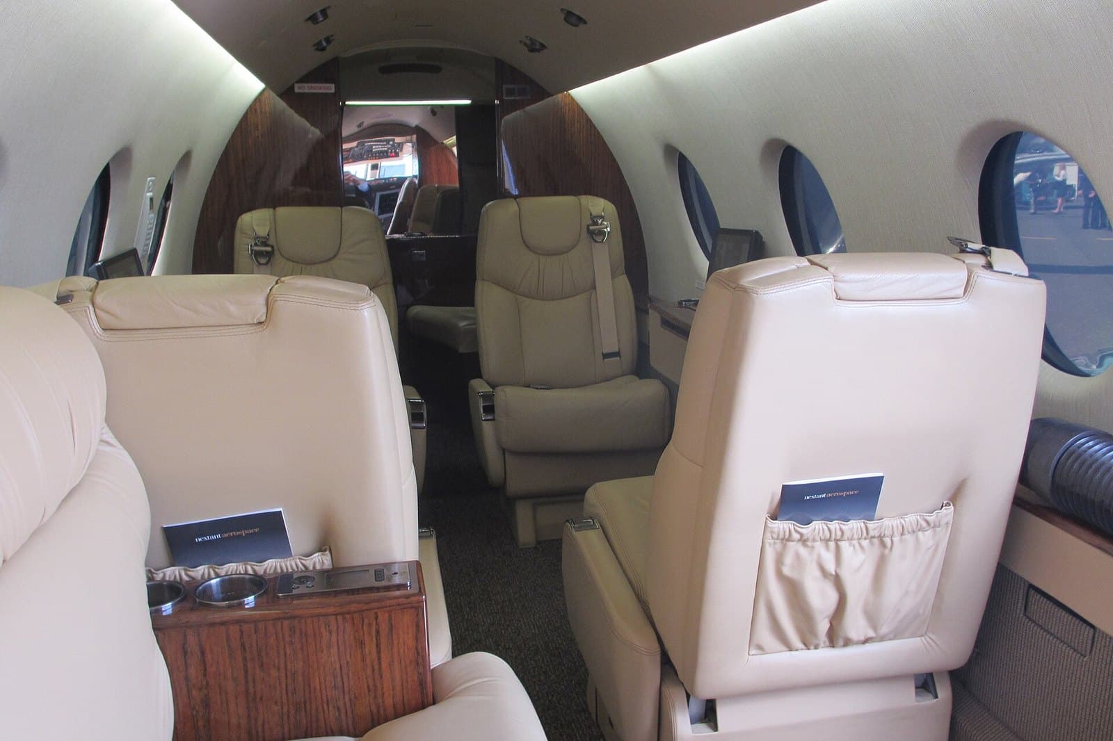 Cabin of a Nextant 400XT with leather club seats, looking aft