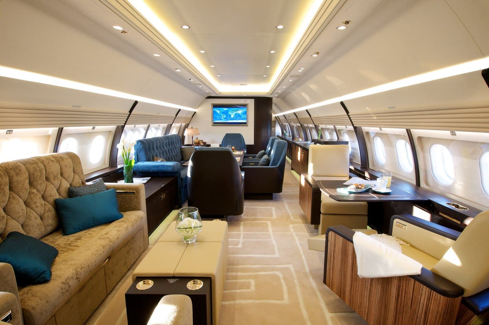 VIP lounge cabin of a Comlux Airbus ACJ320 with sofas and a dining area