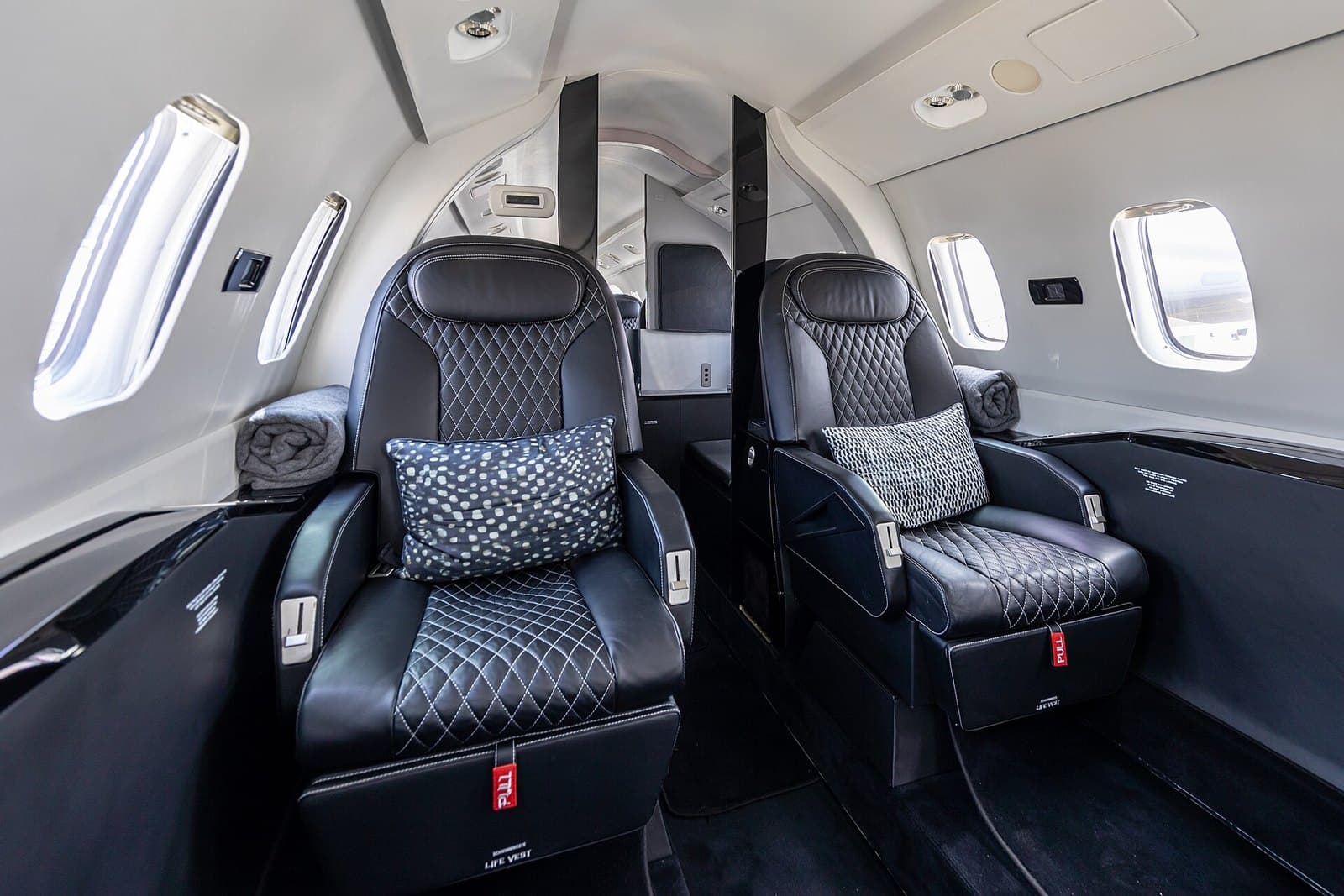 Cabin of a Piaggio P.180 Avanti EVO with quilted leather club seats