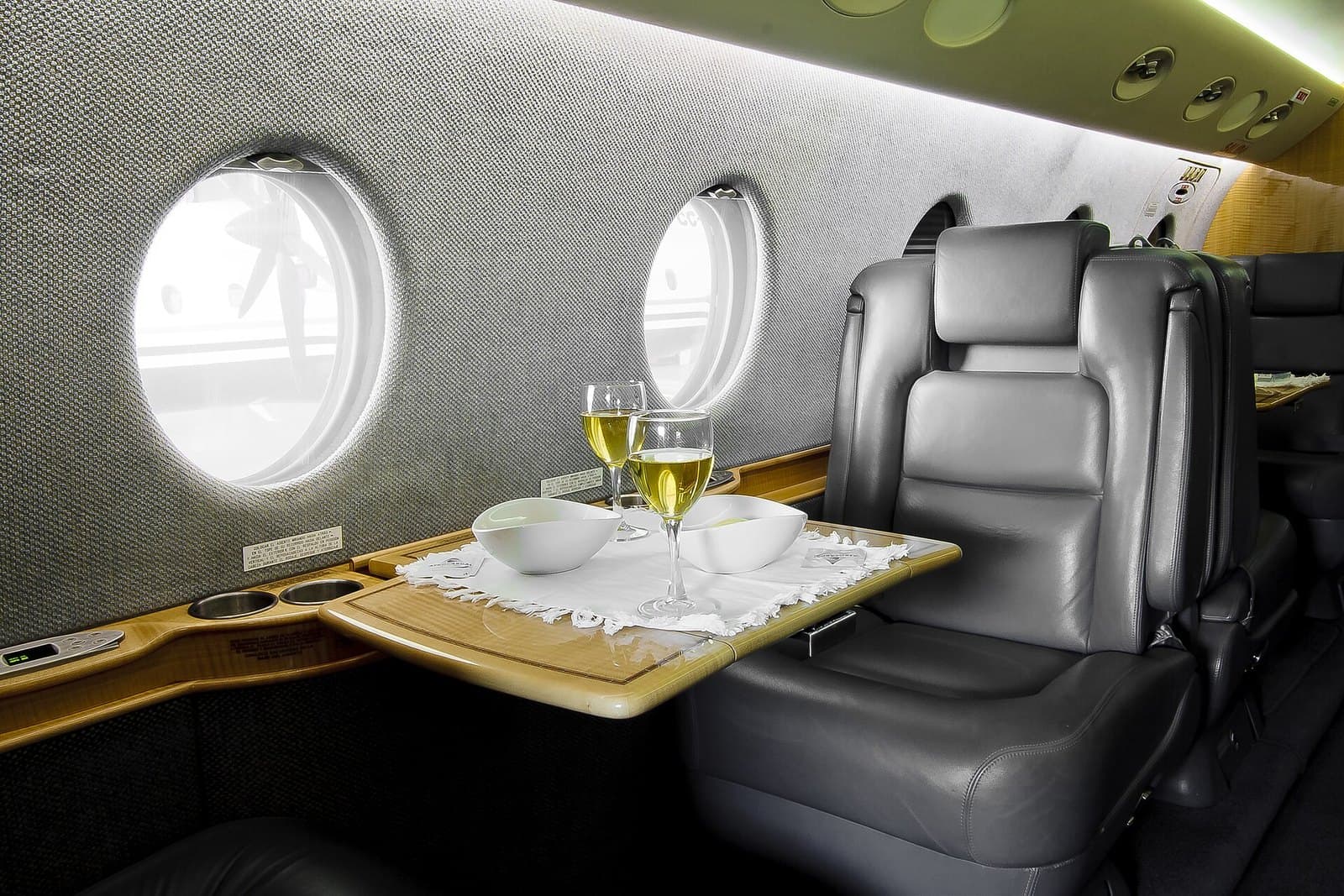 Leather seat and dining table in the cabin of a Gulfstream G150
