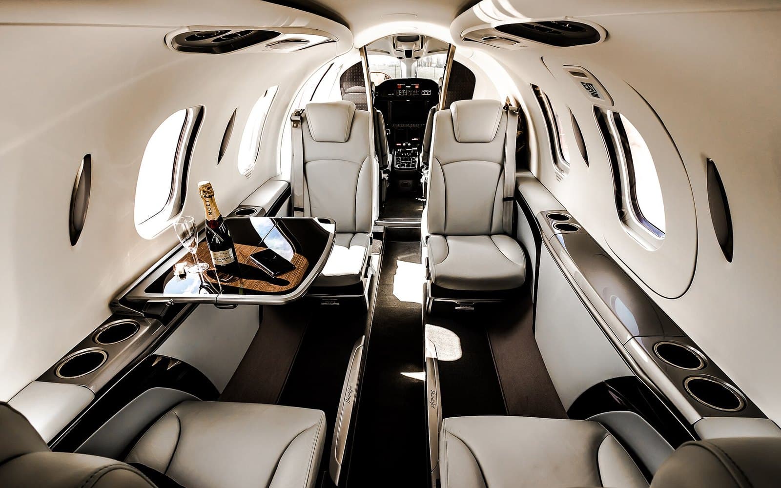 Cabin of a HondaJet with club seats and a fold-out table