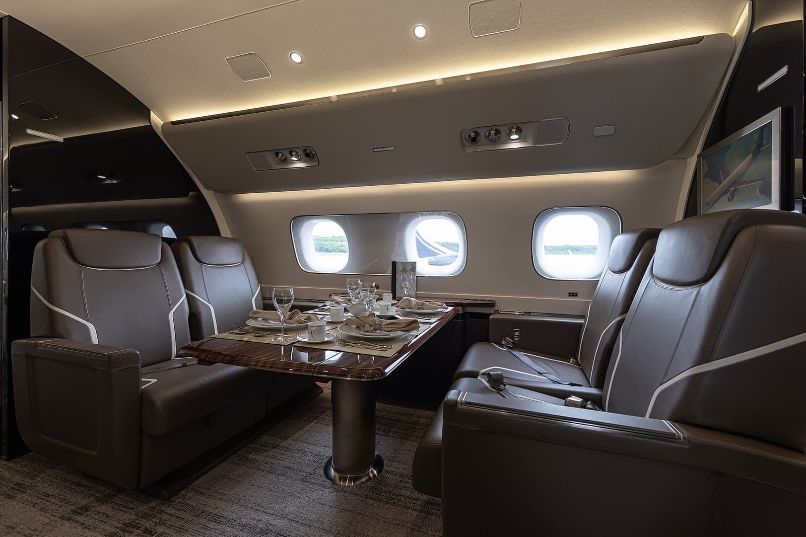 Dining and lounge area in the cabin of an Embraer Lineage 1000