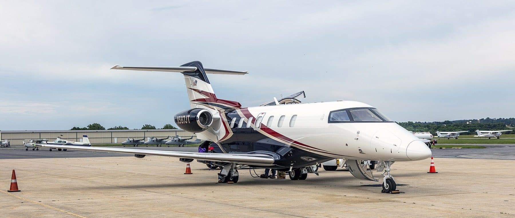 Pilatus PC-24 N587JT, side profile on the ramp