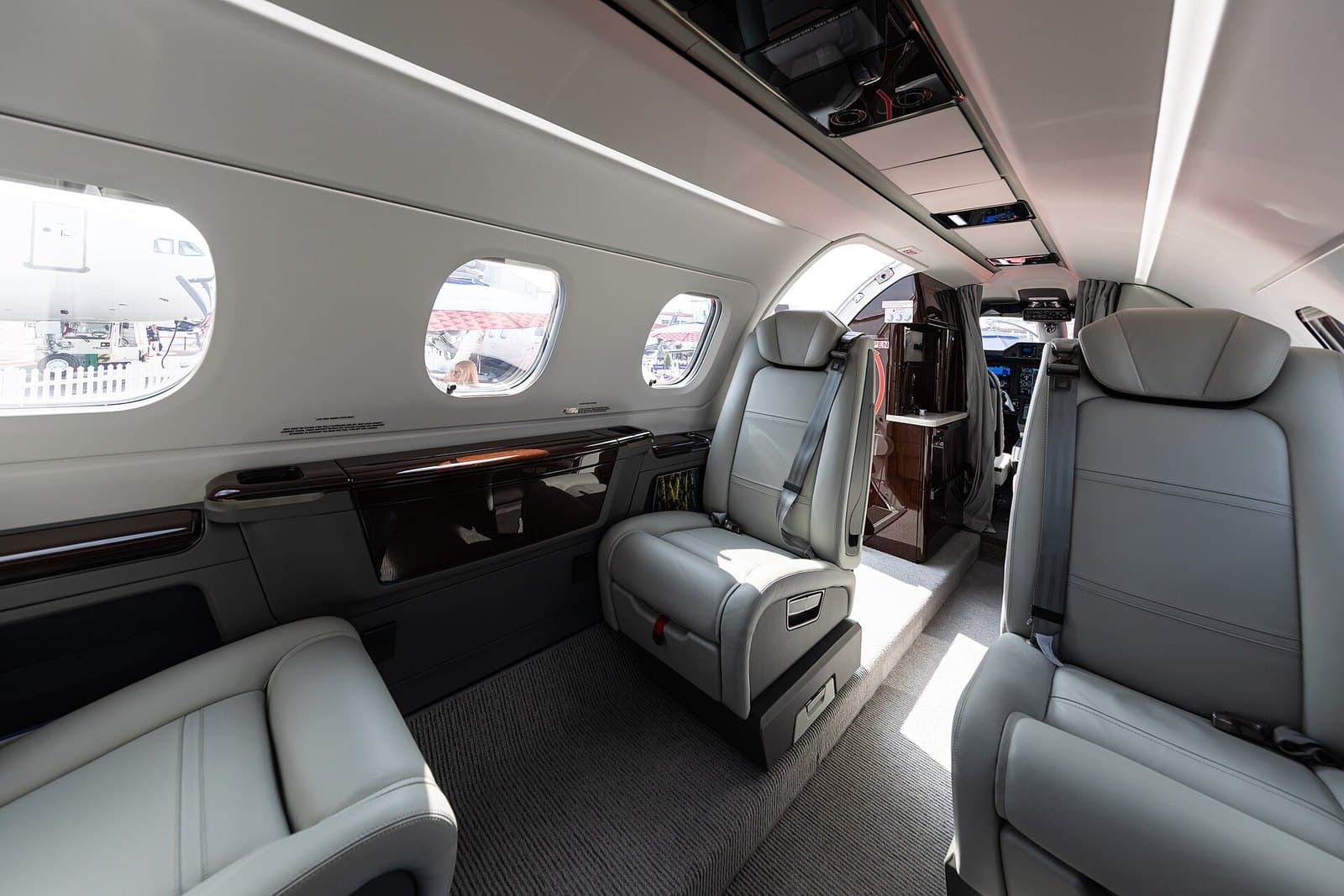 Cabin of an Embraer Phenom 300E with leather club seats